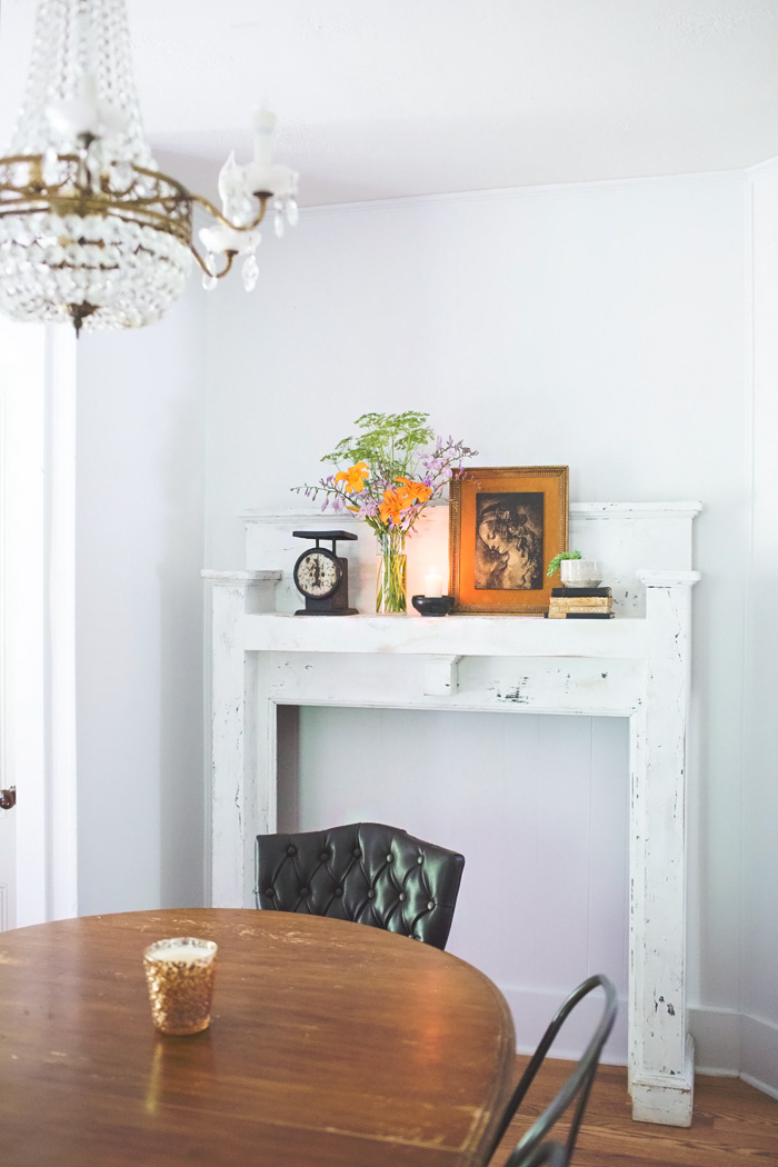 vintage inspired dining room faux mantel and crystal chandelier salvaged mantel in dining room with crystal chandelier