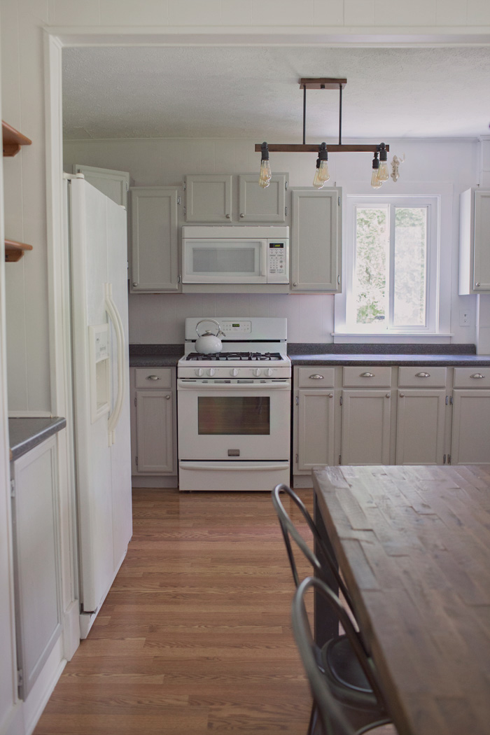 Industrial Gray Farmhouse Kitchen kitchen makeover with gray paint and industrial light fixture